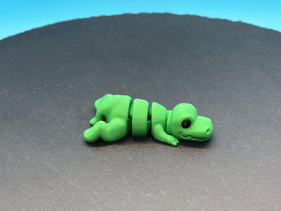 Articulated Mini T-Rex – 3D-printed articulated flexi fidget toy by 3DHotshop